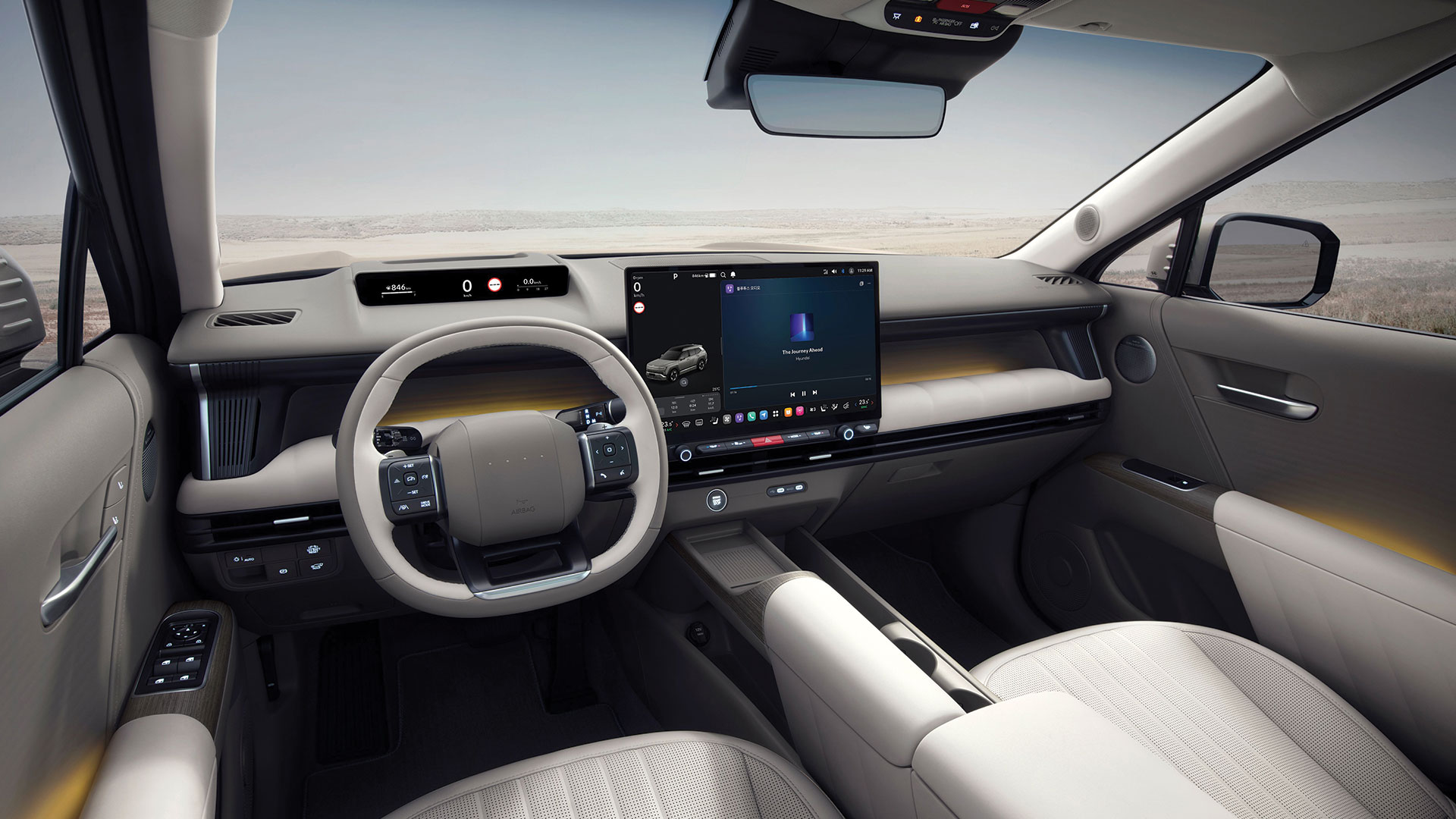 Yeni Hyundai Tucson kabininde geniş ekran ve fiziksel düğmelerin yer aldığı gösterge paneli